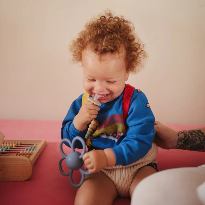 Daisy Rattle Teether - Faded Denim by Mushie & Co - Image 6