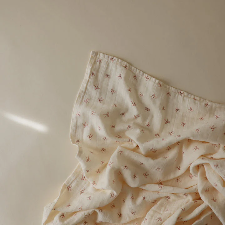 Organic Muslin Swaddle - Bows by Mushie & Co - Image 2
