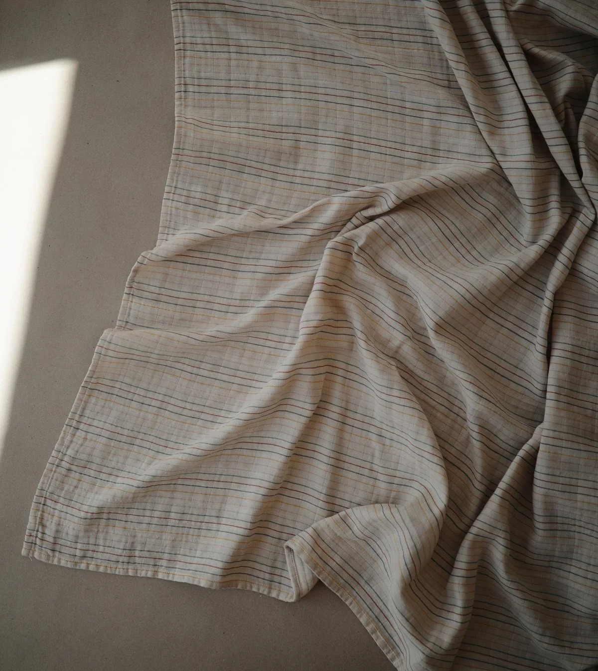 Organic Muslin Swaddle - Retro Stripes by Mushie & Co - Image 2