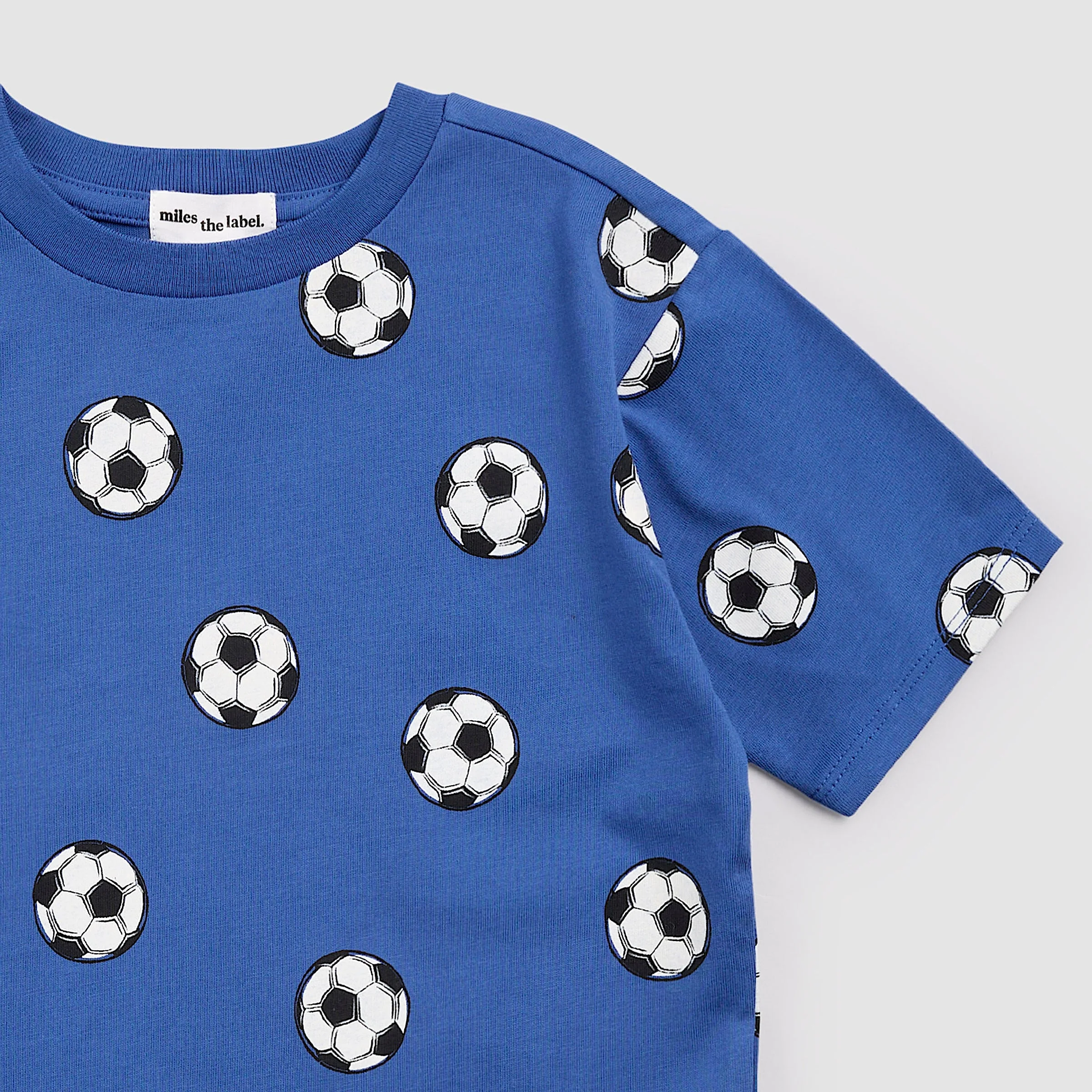 T-Shirt - Soccer Balls on Royal Blue by miles the label. - Image 2